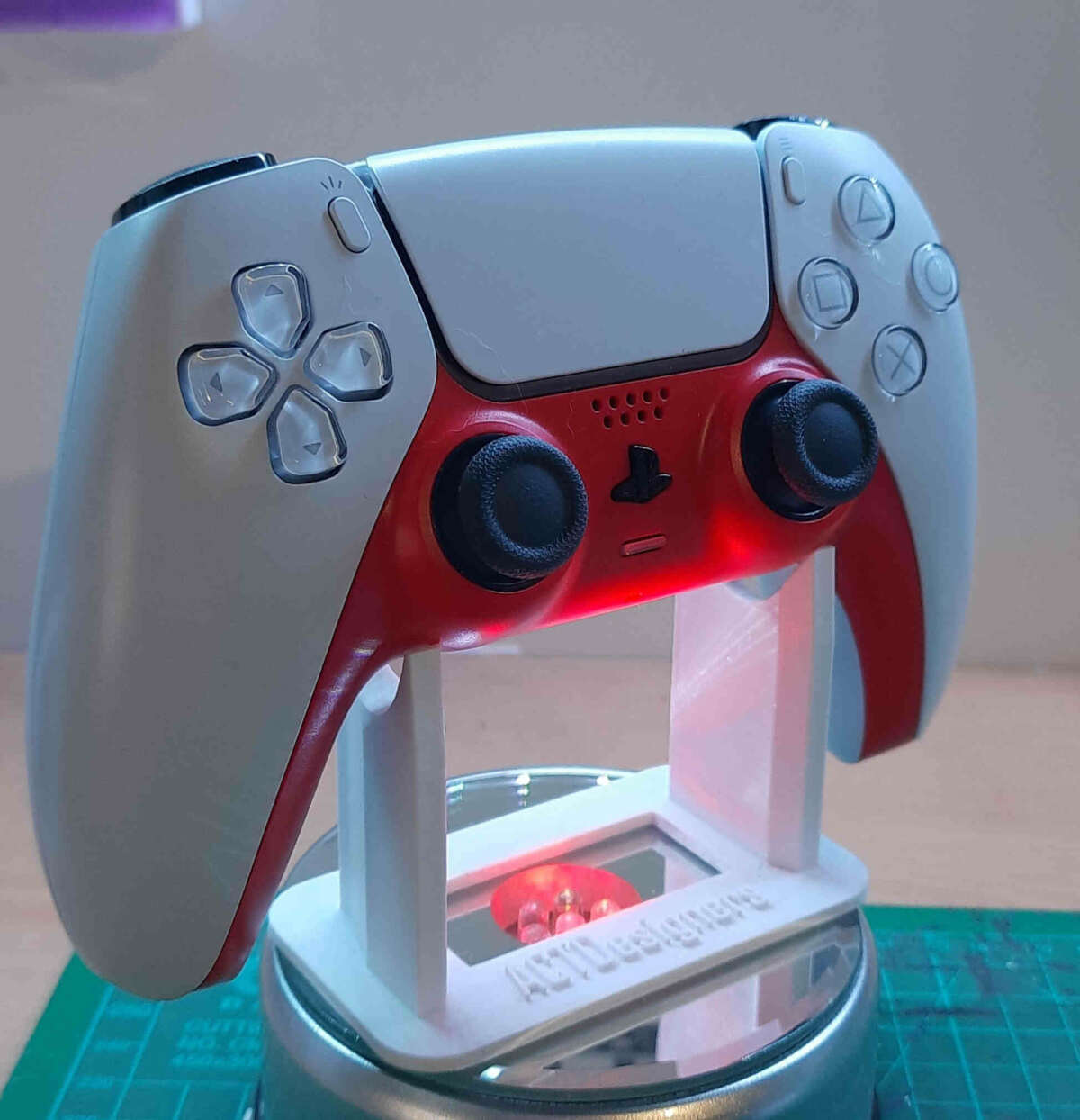 A Universal controller stand capable of holding and displaying xbox, playstation and nintendo controllers.